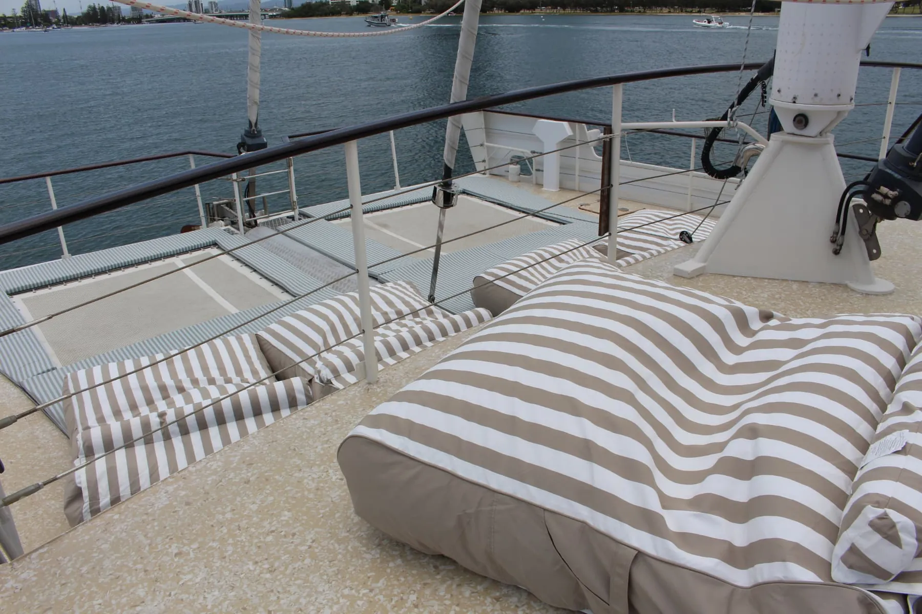 Beanbags and bolsters across the foredeck on a Gold Coast sailing voyage aboard VOYŌ