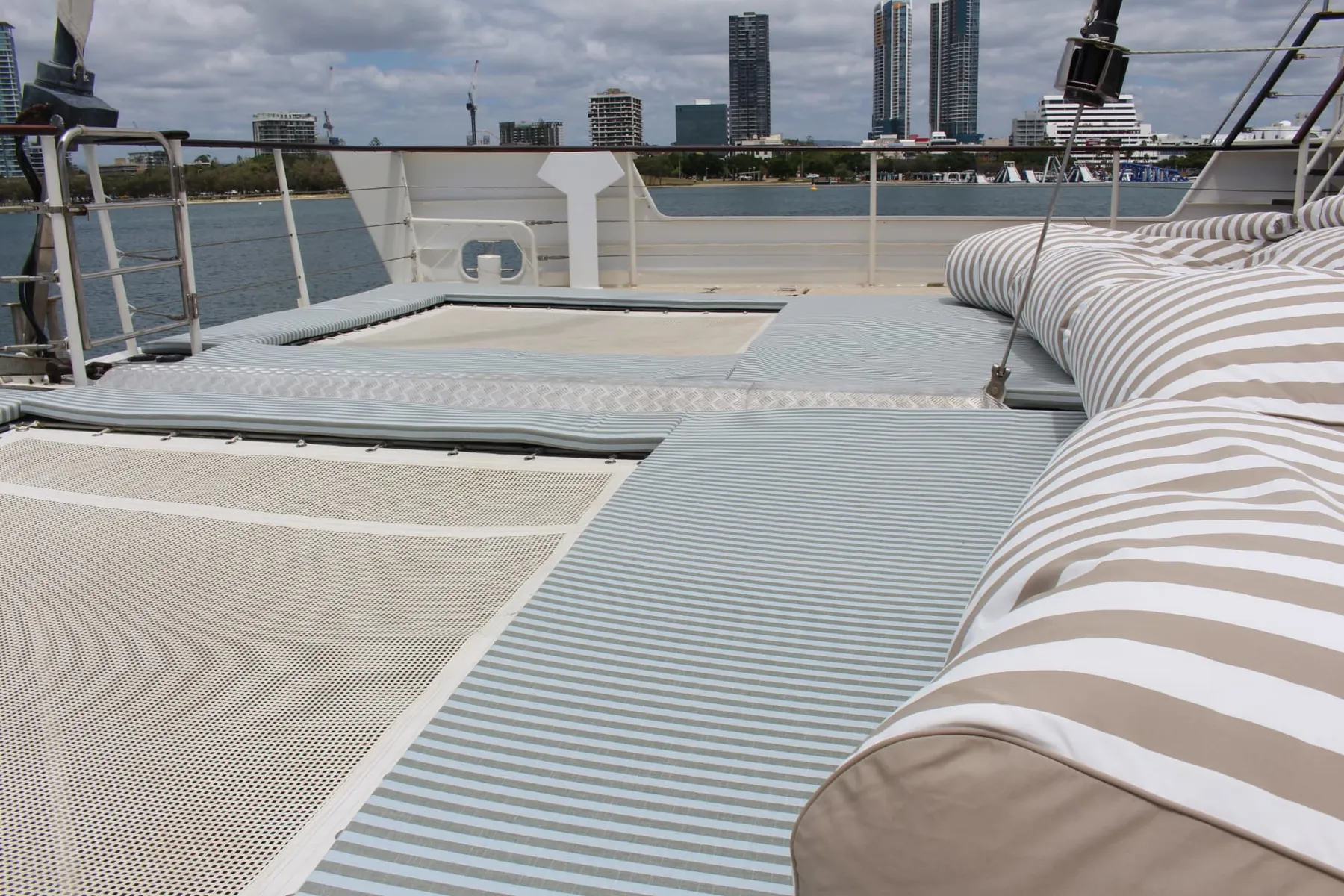 Padded trampoline nets and cushioned bolsters on the bow of a Gold Coast sailing superyacht