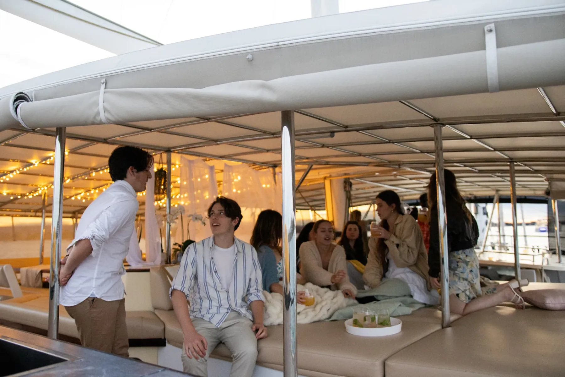 The curtained Cabana lounge on Gold Coast sailing superyacht VOYŌ